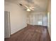 Carpeted bedroom with a ceiling fan and a view of the staircase landing at 3352 Hamlet Loop, Winter Park, FL 32792