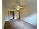 Spacious bedroom with a ceiling fan, closet, and ample natural light at 3352 Hamlet Loop, Winter Park, FL 32792