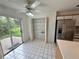 Bright kitchen featuring white cabinets, tile flooring, and stainless-steel appliances at 3352 Hamlet Loop, Winter Park, FL 32792