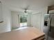 Bright kitchen featuring white cabinets, tile flooring, and stainless-steel appliances at 3352 Hamlet Loop, Winter Park, FL 32792