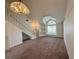 Bright living room featuring high ceilings, lots of natural light, and a staircase at 3352 Hamlet Loop, Winter Park, FL 32792