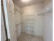 Walk-in closet with built-in shelving for organized storage solutions at 3352 Hamlet Loop, Winter Park, FL 32792
