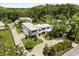 Stunning aerial view of a modern home with a long driveway and mature landscaping at 350 Northwind Rd, Maitland, FL 32751