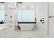 Sleek bathroom with a modern bathtub, dual vanity, and a spacious shower area with minimalist design at 350 Northwind Rd, Maitland, FL 32751