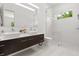 Modern bathroom with double vanity, sleek fixtures, and glass enclosed shower at 350 Northwind Rd, Maitland, FL 32751