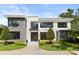 Modern two-story home showcasing clean lines, large windows, and professionally landscaped front yard at 350 Northwind Rd, Maitland, FL 32751