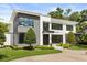 Contemporary home featuring a striking facade, manicured lawn, and modern architectural details at 350 Northwind Rd, Maitland, FL 32751
