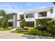 Elegant house boasts a modern design, verdant landscaping, and striking architectural elements at 350 Northwind Rd, Maitland, FL 32751