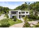 Contemporary two-story home with a manicured lawn and modern architectural details at 350 Northwind Rd, Maitland, FL 32751