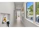 Bright hallway featuring modern art, built-in shelving, and an umbrella stand at 350 Northwind Rd, Maitland, FL 32751
