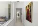 Hallway with white walls, recessed lighting, and large windows, featuring modern art at 350 Northwind Rd, Maitland, FL 32751