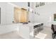 Modern kitchen featuring sleek white cabinets, state-of-the-art appliances, and a large center island at 350 Northwind Rd, Maitland, FL 32751