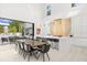 Modern kitchen with large island, bar seating, and a sliding glass door to the outdoor living space at 350 Northwind Rd, Maitland, FL 32751