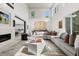 Spacious living room showcasing soaring ceilings, ample natural light, and seamless connection to the kitchen at 350 Northwind Rd, Maitland, FL 32751