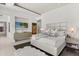 Luxurious main bedroom with a plush rug, TV, a decorative headboard, and modern furniture at 350 Northwind Rd, Maitland, FL 32751