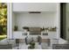 Outdoor kitchen with stainless steel grill and seating area at 350 Northwind Rd, Maitland, FL 32751