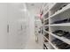 Well-organized walk-in closet featuring built-in storage, shoe racks, and ample space at 350 Northwind Rd, Maitland, FL 32751