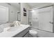 Bathroom featuring granite countertops, stainless steel faucet, and a large shower with glass door at 369 Ocean Course Ave, Davenport, FL 33896