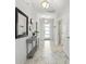 Bright and airy foyer featuring tile flooring, a decorative console table, and an open view into the entry door at 369 Ocean Course Ave, Davenport, FL 33896