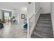 Open-concept living room with tiled floors and plenty of natural light at 369 Ocean Course Ave, Davenport, FL 33896