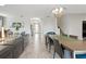 Open-concept living space featuring tile floors and an open layout, seamlessly connecting to the dining area and the foyer at 369 Ocean Course Ave, Davenport, FL 33896