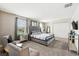 Spacious main bedroom with a large bed, mirrored nightstands, and a closet at 369 Ocean Course Ave, Davenport, FL 33896