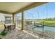 Covered patio with a dining area and a fenced pool area, perfect for outdoor gatherings at 369 Ocean Course Ave, Davenport, FL 33896