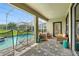 Screened-in patio with comfortable seating area and a pool, ideal for relaxation and leisure at 369 Ocean Course Ave, Davenport, FL 33896
