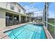 Private screened-in pool, hot tub, and relaxing poolside, perfect for outdoor enjoyment at 369 Ocean Course Ave, Davenport, FL 33896