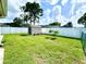 Spacious backyard with a storage shed, lush green lawn, and privacy fence at 3708 Beaver Ridge Dr, Orlando, FL 32829