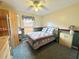 Cozy bedroom with neutral walls, carpeted floor, ceiling fan and comfortable bed at 3708 Beaver Ridge Dr, Orlando, FL 32829