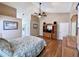 Another angle of bedroom with wooden floors and vaulted ceilings showing a TV cabinet and décor at 3708 Beaver Ridge Dr, Orlando, FL 32829