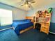 Cozy bedroom with blue walls, ceiling fan, desk and storage; perfect for a  at 3708 Beaver Ridge Dr, Orlando, FL 32829