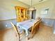 Formal dining room with wood table, seating for eight, and a china hutch at 3708 Beaver Ridge Dr, Orlando, FL 32829