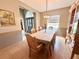 Inviting dining room with large table, chandelier lighting, and view of the front entryway at 3708 Beaver Ridge Dr, Orlando, FL 32829