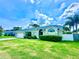 Landscaped front yard and exterior of the home featuring a two-car garage and light-grey paint at 3708 Beaver Ridge Dr, Orlando, FL 32829