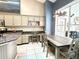 Open kitchen featuring a large island, breakfast bar, granite countertops, and a cozy dining area at 3708 Beaver Ridge Dr, Orlando, FL 32829