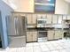 Spacious kitchen with stainless steel appliances, including a refrigerator, oven, and microwave at 3708 Beaver Ridge Dr, Orlando, FL 32829