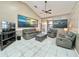 Spacious living room with high ceilings, tile floors, and comfortable seating arrangement at 3708 Beaver Ridge Dr, Orlando, FL 32829