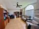 Spacious living room featuring vaulted ceiling, lots of storage, a large window, and comfortable furnishings at 3708 Beaver Ridge Dr, Orlando, FL 32829