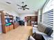 Spacious living room with vaulted ceiling, tile floors, and a large picture window at 3708 Beaver Ridge Dr, Orlando, FL 32829