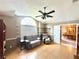 Cozy living room features a ceiling fan, and view into the dining room at 3708 Beaver Ridge Dr, Orlando, FL 32829