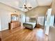 Spacious main bedroom with vaulted ceilings, wooden floors, and neutral décor at 3708 Beaver Ridge Dr, Orlando, FL 32829