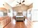 Bright main bedroom featuring wooden floors, a vaulted ceiling, and ample natural light at 3708 Beaver Ridge Dr, Orlando, FL 32829