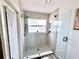 Updated shower with stone floor and glass surround at 3708 Beaver Ridge Dr, Orlando, FL 32829