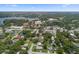 Aerial view featuring a vast landscape with the property nestled among mature trees and buildings at 3722 Neptune Dr, Orlando, FL 32804