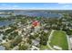 Aerial view showing the property's location amidst lush greenery, a large lake, and nearby athletic fields at 3722 Neptune Dr, Orlando, FL 32804