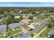 Aerial view showcases the property's location in a residential neighborhood surrounded by mature trees at 3722 Neptune Dr, Orlando, FL 32804