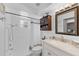 Bathroom featuring white shower, vanity, and cabinet for storage at 3722 Neptune Dr, Orlando, FL 32804