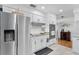 Kitchen featuring stainless steel appliances, white cabinetry and tile flooring at 3722 Neptune Dr, Orlando, FL 32804